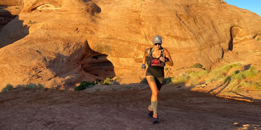 Team Injinji manager Izzy running in the desert. 