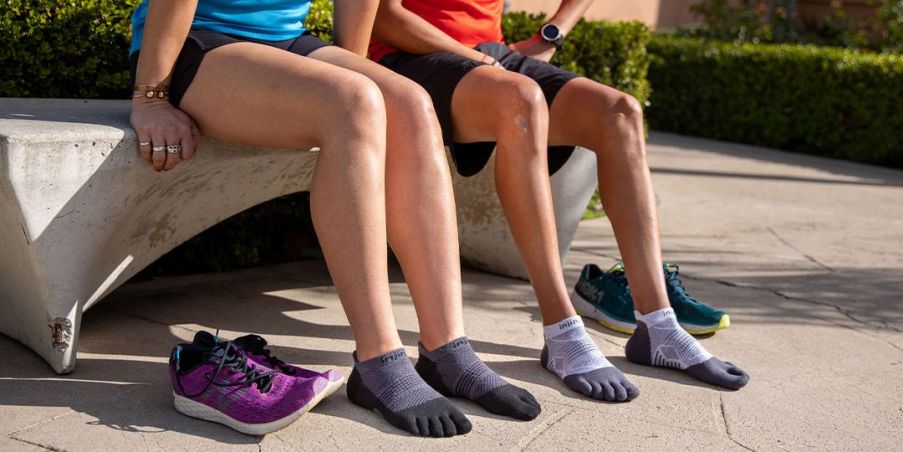 Women sitting on a bench wearing the Run Lightweight No-Show