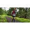 Team Injinji Athlete Andrew Miller running on a lush forested trail.