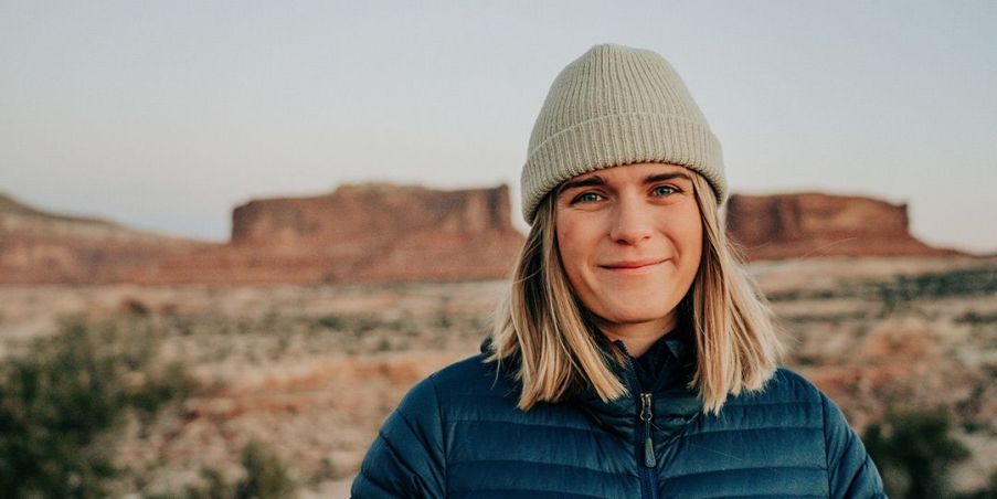 Kika McFarlane standing in front of desert mesas in the distance. 