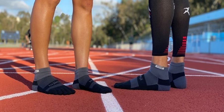 Track runners equipped with the Run Lightweight Mini-Crew.