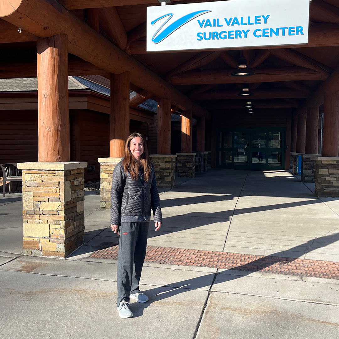 Trish Ardens smiling and standing in front of Vail Valley Surgery Center.