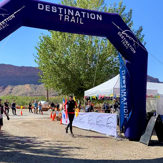 2021 Moab 240 winner, Mike McKnight, crossing the finish line at the Moab 240 ultramarathon.