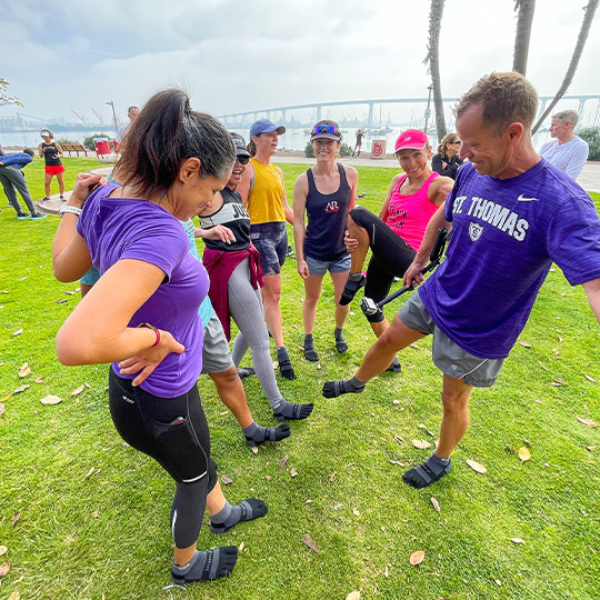 San Diego Track Club runners do an all-in using their feet while wearing Injinji toesocks. 