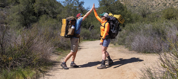 Two people giving a high five