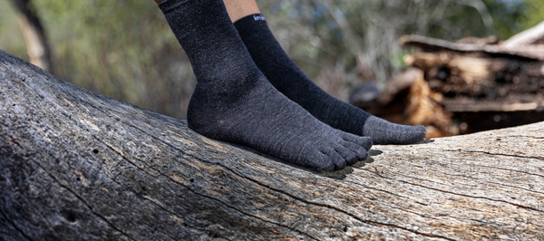 Feet on tree trunk